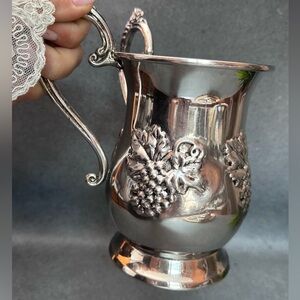 Elegant Silver Pitcher with Grape Design